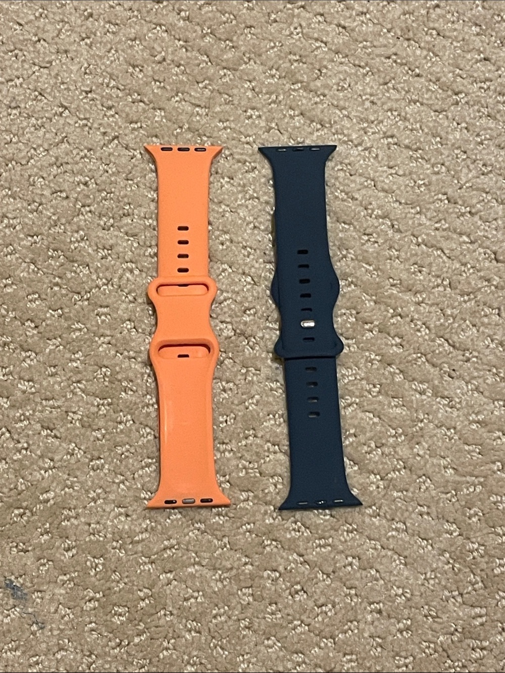 Apple Watch wristbands (navy blue and pale orange)